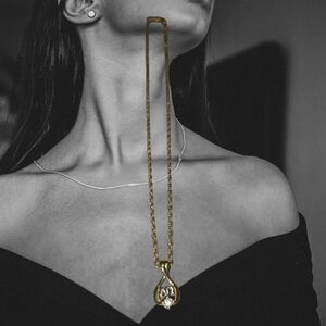 Nina Ricci Elegant Gold Pendant Necklace
